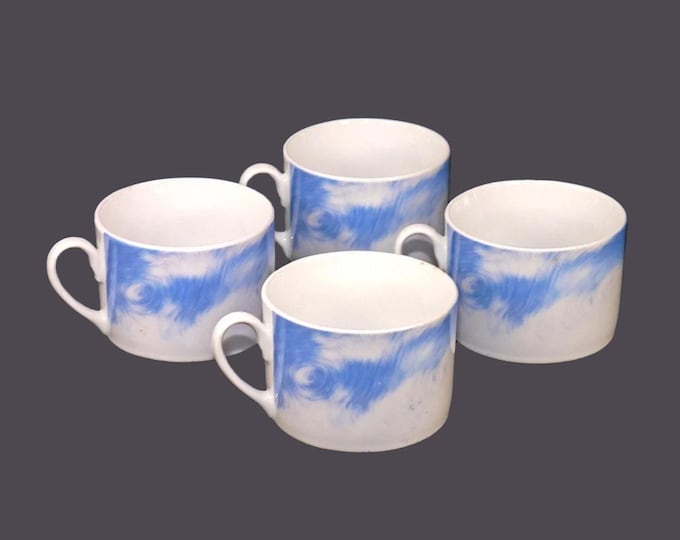 Four Stokes Fluffy Cloud coffee cans only. White clouds and blue sky.