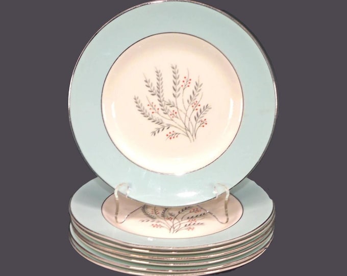 Seven Homer Laughlin Triumph dessert plates made in USA. Flaw (see below).