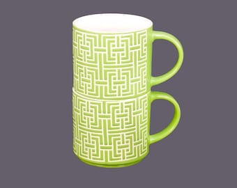 Retro vintage lime green coffee or tea mugs. High-relief geometric motif in white.