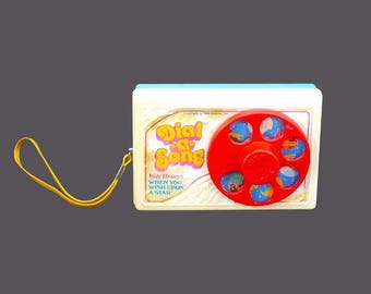 Walt Disney Dial a Song from 1963. Plays When You Wish Upon a Star. Working. Made in Hong Kong by LJN Toys.