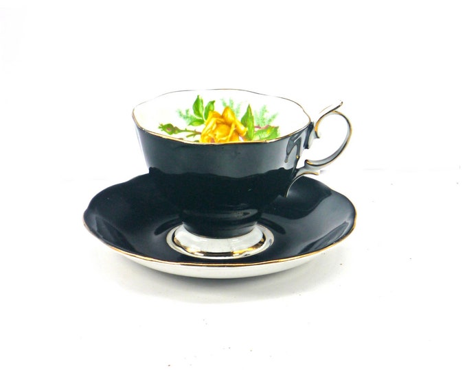 Royal Albert black and yellow roses bone china cup and saucer set made in England.