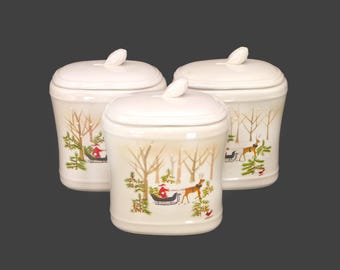 Three Hallmark Cards Christmas canisters. Santa and his reindeer-driven sleigh, winter scene. Holiday decor.