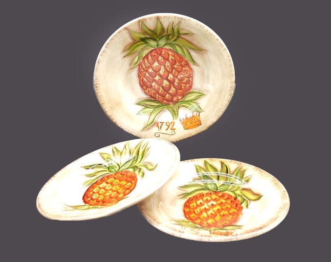 Three Tabletops Unlimited Tropical Pineapple salad plates. Pineapple in center.