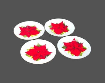 Four Isaac Mizrahi Christmas poinsettias dessert plates.