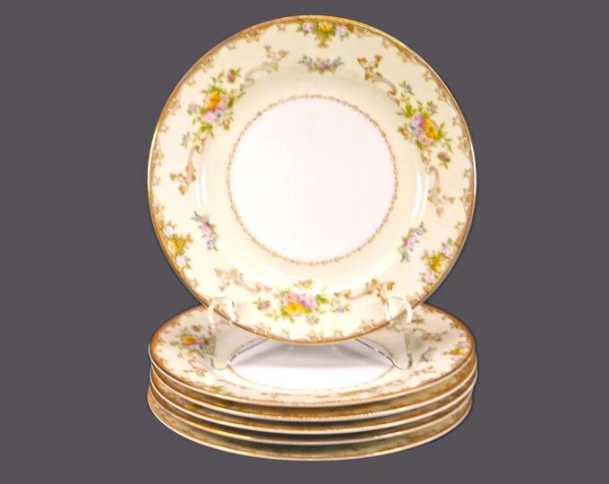 Six Meito hand-painted Nippon bread plates. Multicolor florals sprays, scrolls. Made in Japan.