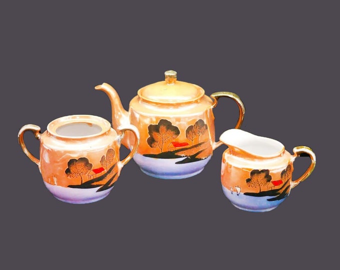 Mid-century hand-painted Nippon Lusterware teapot, creamer and sugar bowl (no lid). Oriental landscape.