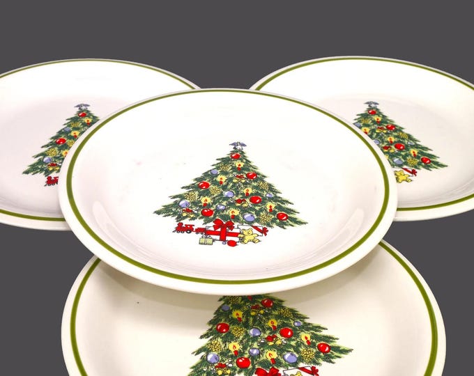 Four CX87 Christmas stoneware dinner plates.