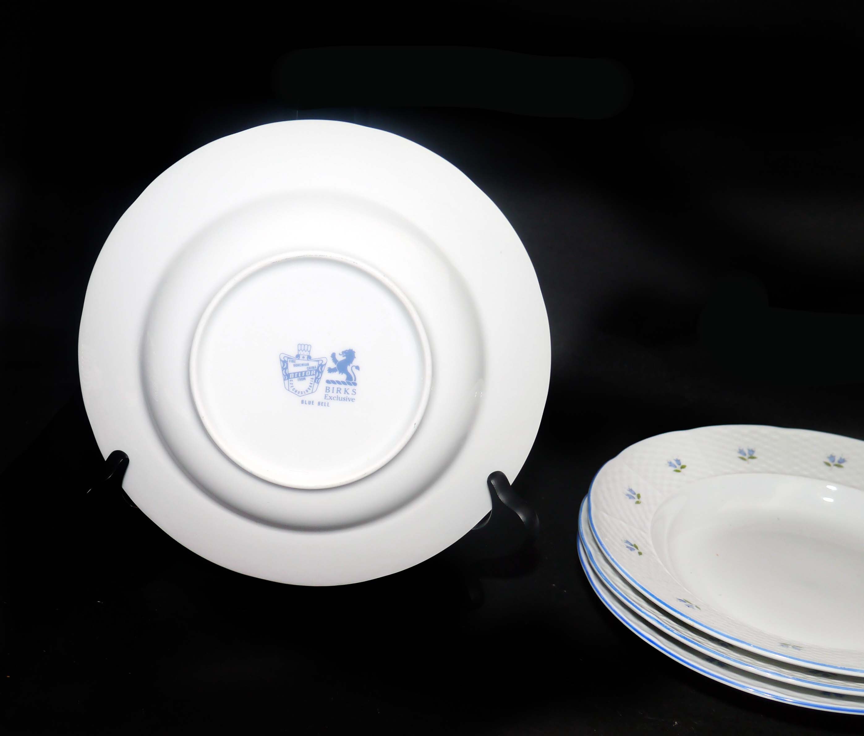 Four Belfor Blue Bell rimmed soup bowls made in Czechoslovakia for Birks.
