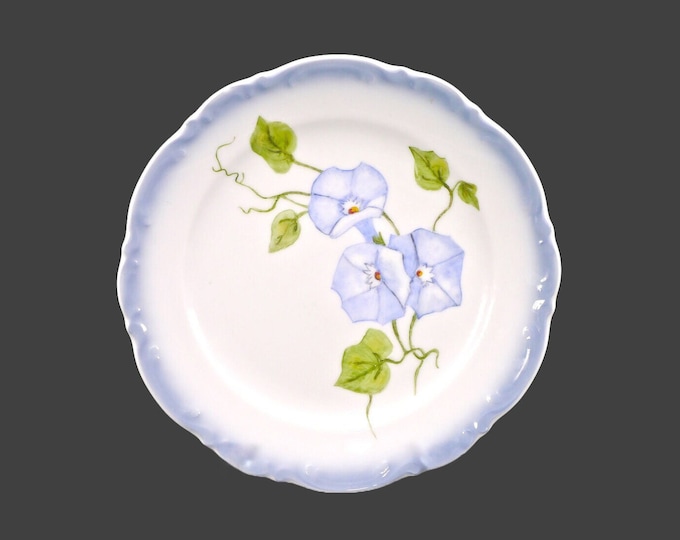 Hand-painted Mitterteich luncheon plate. Central blue florals, greenery, embossed blue rim. Signed dated to reverse Monsus 1994.