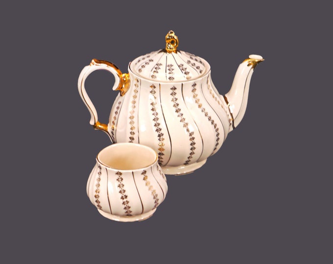 Sadler 3403 hand-decorated four-cup teapot with matching open sugar bowl made in England. Minor flaw (see below).