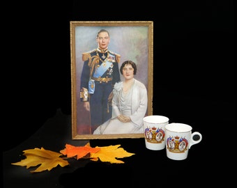 Royalty set. Framed color portrait of King George and Queen Elizabeth and two Coronation mugs. New Percival Furniture Co.