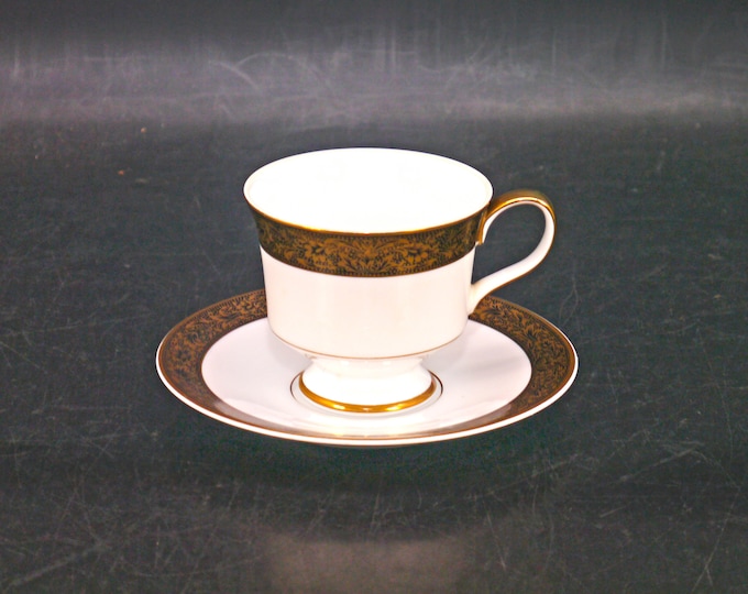 Sango Hampton 3758 cup and saucer set made in Japan. Black with encrusted gold. Sold individually.