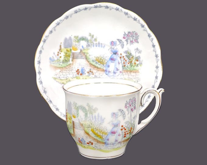Bell China 2544 bone china cup and saucer set made in England. Lady with parasol in garden. Flaw (see below).