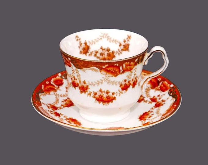 Collingwoods 134 bone china cup and saucer set made in England. Rust floral swags.