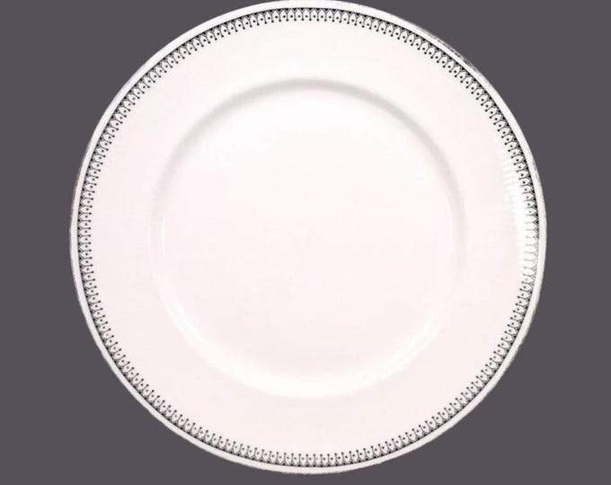Paragon Olympus bone china dinner plate made in England. Flaw (see below). Sold individually.