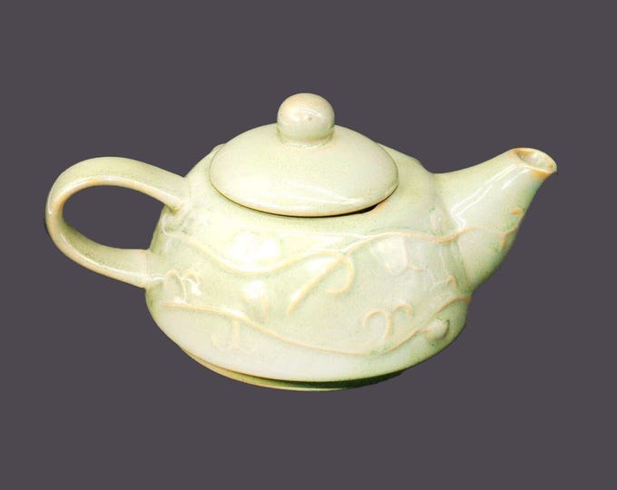 Pier 1 mini | tea-for-one | personal | small stoneware teapot. Raised leaves and berries, light green ground.