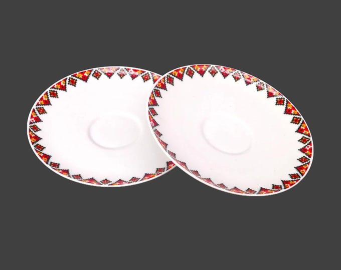 Pair of Rosenthal Raymond Loewy designed orphaned saucers only in a traditional Ukranian motif made in Germany.