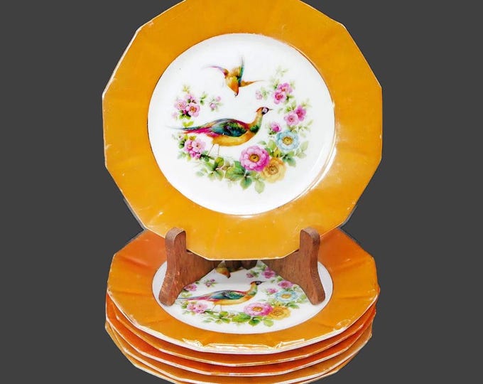 Six antique orange lusterware dessert plates. Peacocks and florals. Made in Germany. Flaws (see below).