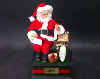 Dear Santa musical Christmas figurine | music box. Santa checking naughty and nice list.