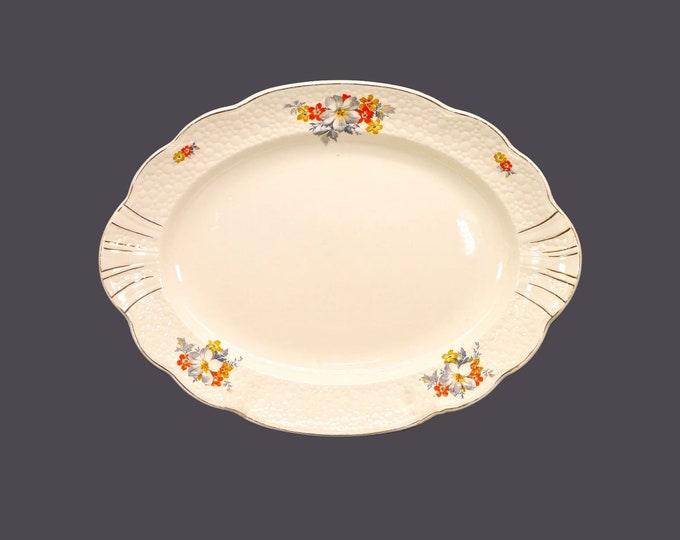 Antique J&G Meakin MEK348 lugged meat platter. Multicolor florals, pebbled embossing. Sol Sunshine Ironstone made in England. Flaw.