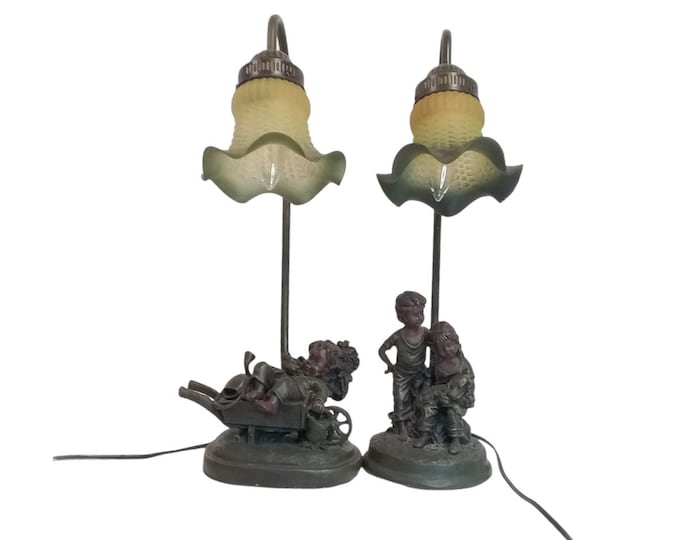 Pair of vintage (attributed 1930s) spelter table lamps. Boy and girl, boy in apple cart. Glass tulip shades.