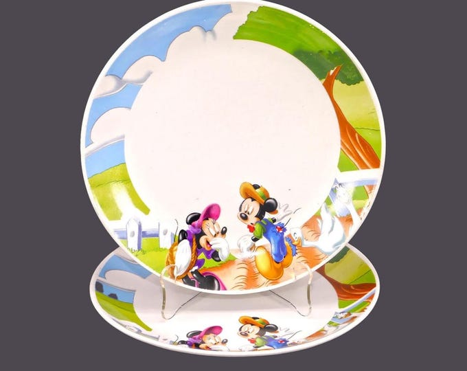 Pair of Gibson Designs GID378 Disney Mickey and Minnie Mouse dinner plates. A duck bites a hole in Mickey's trousers.