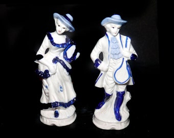 Pair of mid-century Dresden-like figurines. Courting Couple man and woman in period Victorian dress. Attributed Taiwan 1950s to 1960.
