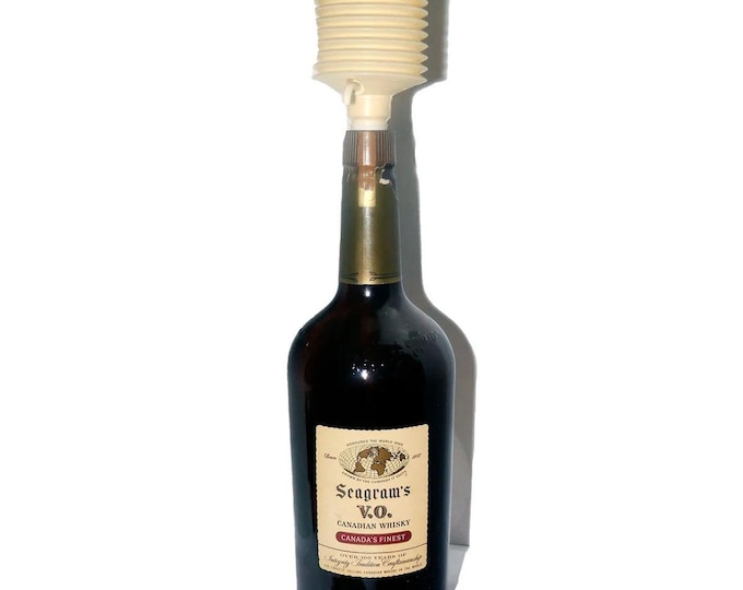 Vintage Seagrams VO Canadian one-gallon whisky bottle. Branded accordion bellows. Most labeling intact.