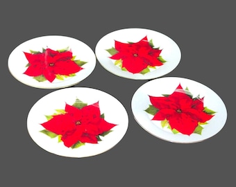 Four Isaac Mizrahi Christmas poinsettias dessert plates.