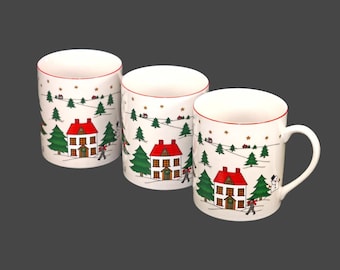 Three Fine China of Japan Christmas Pleasure JAP97 porcelain coffee or tea mugs with red trim.