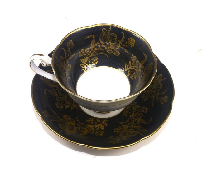 Woodville China black and gold florals cup and saucer set. Bone china made in Japan. Minor flaw (see below).