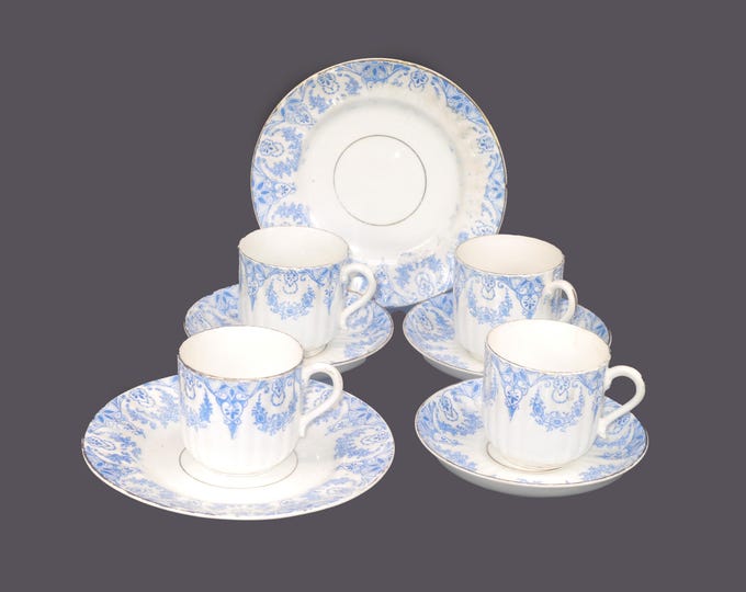 Nine pieces of antique Victorian blue-and-white tableware. Blue scrolls, wreaths, florals. Marked 928. Attributed Brownfield.