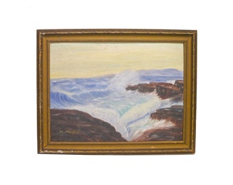 Original signed oil on canvas painting of a waterscape. Rough waves crash against rocks. Framed. Signed M. Martin.