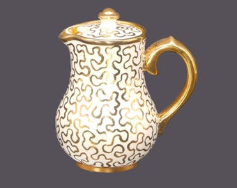 Vintage Sudlow's 0657 cream or milk pitcher. Gold squiggle pattern. Made in England.