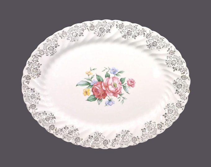 Johnson Brothers oval platter. Pink red roses, blue yellow flowers, filigree. Snowhite Regency Ironstone made in England. Flaw (see below)