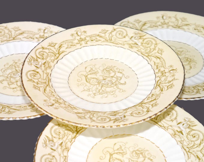 Four antique later Victorian era H.M. Williamson & Sons Griffin 79519 bread or dessert plates made in England. Very rare.