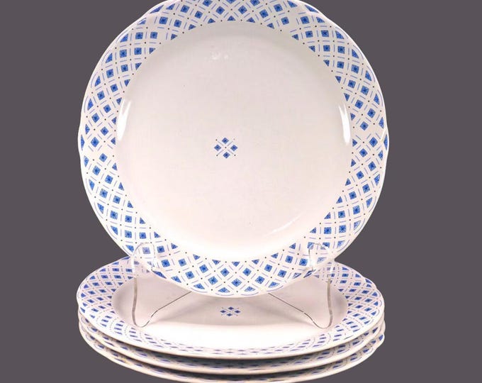 Four Royal Oak blue-and-white large dinner plates. Blue diamonds | triangles and black stars on white.