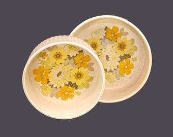 Pair of Ulster Ceramics round stoneware souffle or casserole dishes made in Ireland. Retro flower-power yellow and orange florals.
