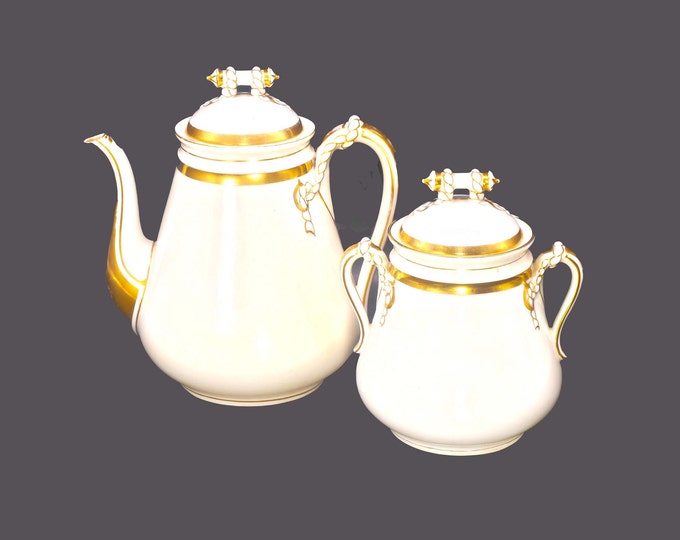 Antique late Victorian-era Hulme & Christie teapot and matching sugar barrel.