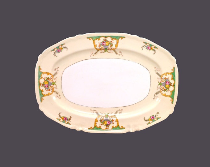 CLP Czechoslovakia oval sandwich tray. Florals in urns, green bars, yellow band, gold edge.