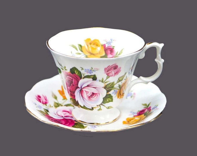 Royal Albert bone china cup and saucer set made in England. Pink, red, yellow roses. Flaw (see below).