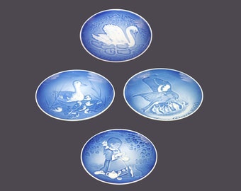 Four Bing & Grondahl Royal Copenhagen decorative wall plates. Mothers Day 1970, 1973, 1976 and Children's Day 1985. Made in Denmark.