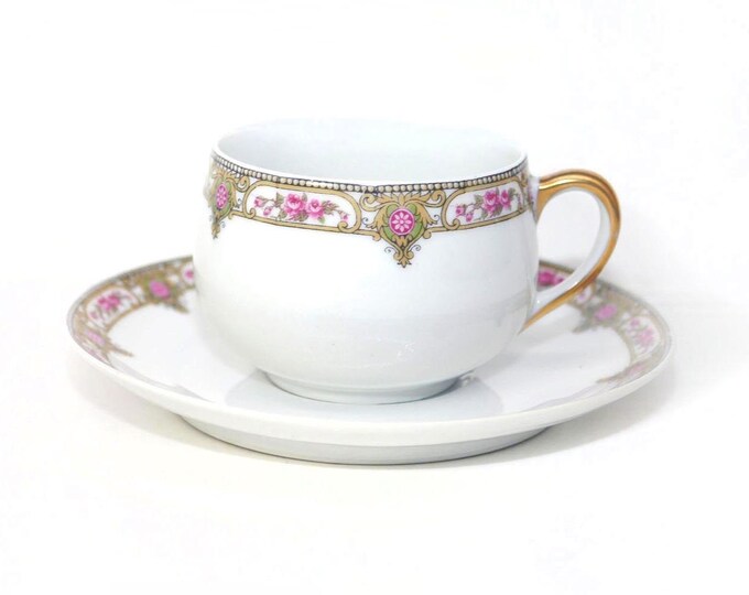 Antique Charles Ahrenfeldt Depose Limoges Classic hand-painted cup and saucer set.