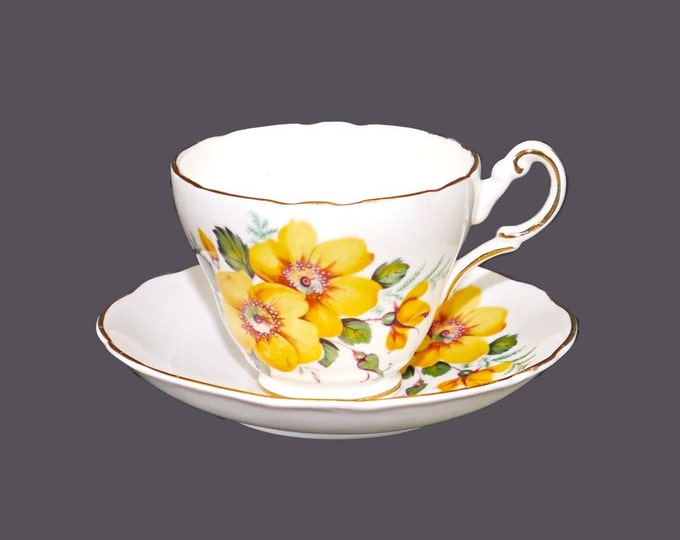 Grosvenor China cup and saucer set made in England. Yellow pansies, gold edge.