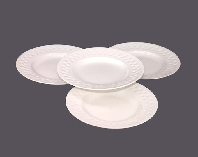 Four Martha Stewart French Cupboard White salad plates. Chef's favorite all-white tableware.