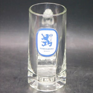Lowenbrau beer pint glass | stein. Easy grip thumbprint handle. Etched-glass branding.