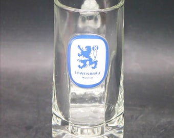 Lowenbrau beer pint glass | stein. Easy grip thumbprint handle. Etched-glass branding.