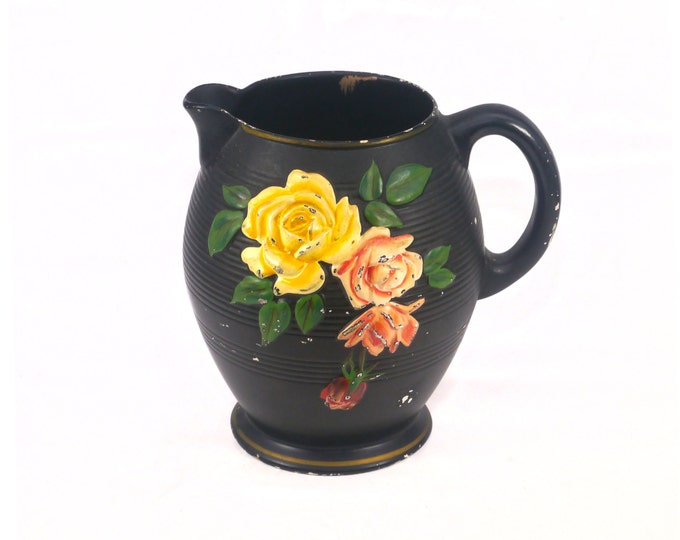Howard Pottery Kempton pitcher. Brentleigh Ware made in England. Black body, high-relief florals. Weathered (see below).