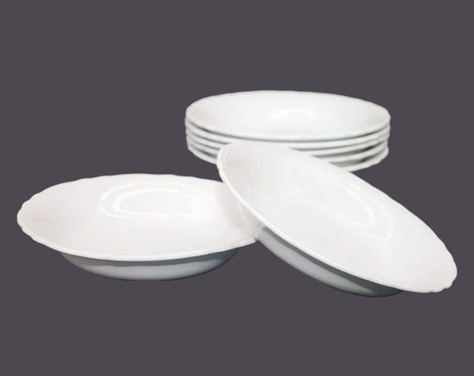Seven Barker Bros Royal Tudor Ware all-white soup bowls embossed details made in England.