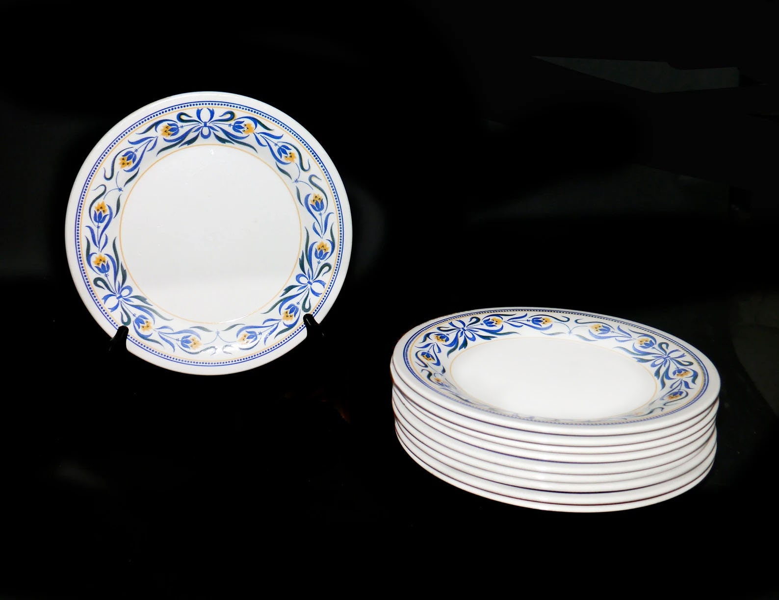 Set of Staffordshire Tableware Biltons dinner plates. Blue ribbons, yellow flowers. Made in